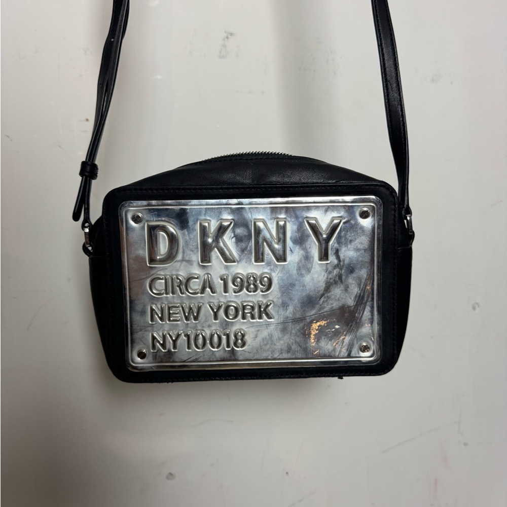 DKNY Black and Silver Messenger Bag with Modern Design